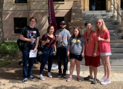 Sam leads AGGie Achieve members around for the Chemistry Open House