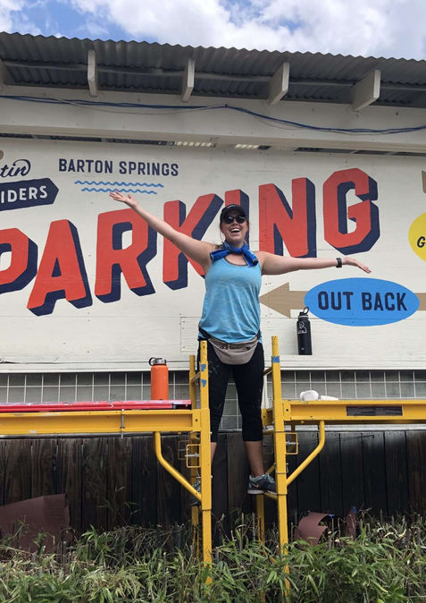 Branding Mural for Austin Eastciders Restaurant on Barton Springs Rd. Hand Painted Parking signage