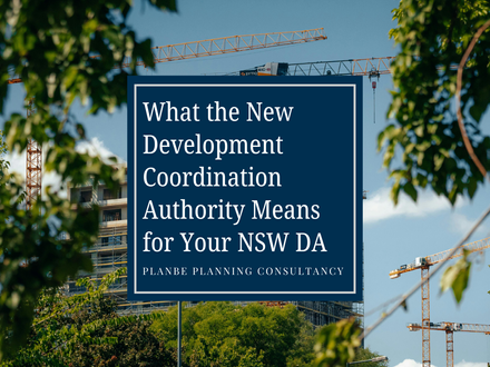 Blue sign amid cranes and trees reads What the New Development Coordination Authority Means for Your NSW DA