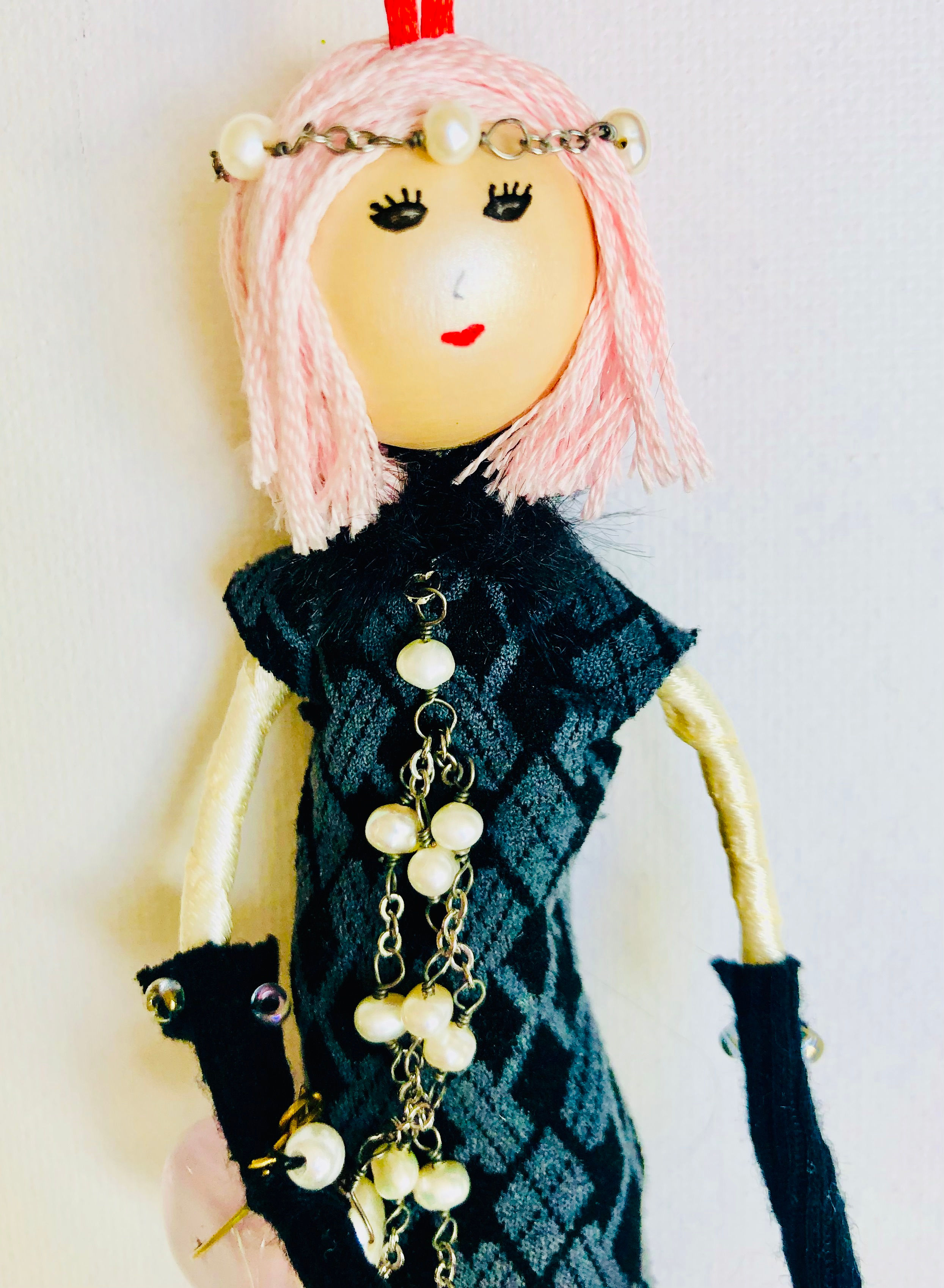 roaring twenties doll with pink hair and black dress
