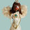 Thumbnail: Singing angel doll with white dress and fuzzy white wings