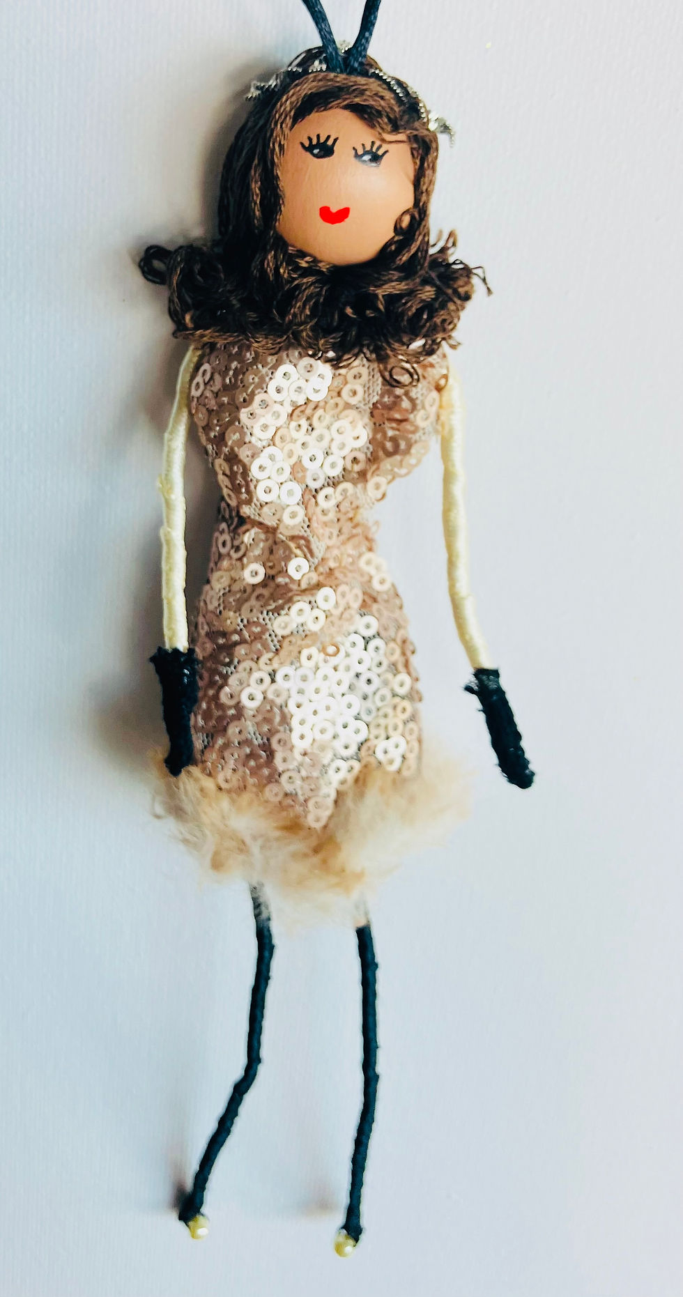 Cosmopolitan doll with brown hair and sparkly dress
