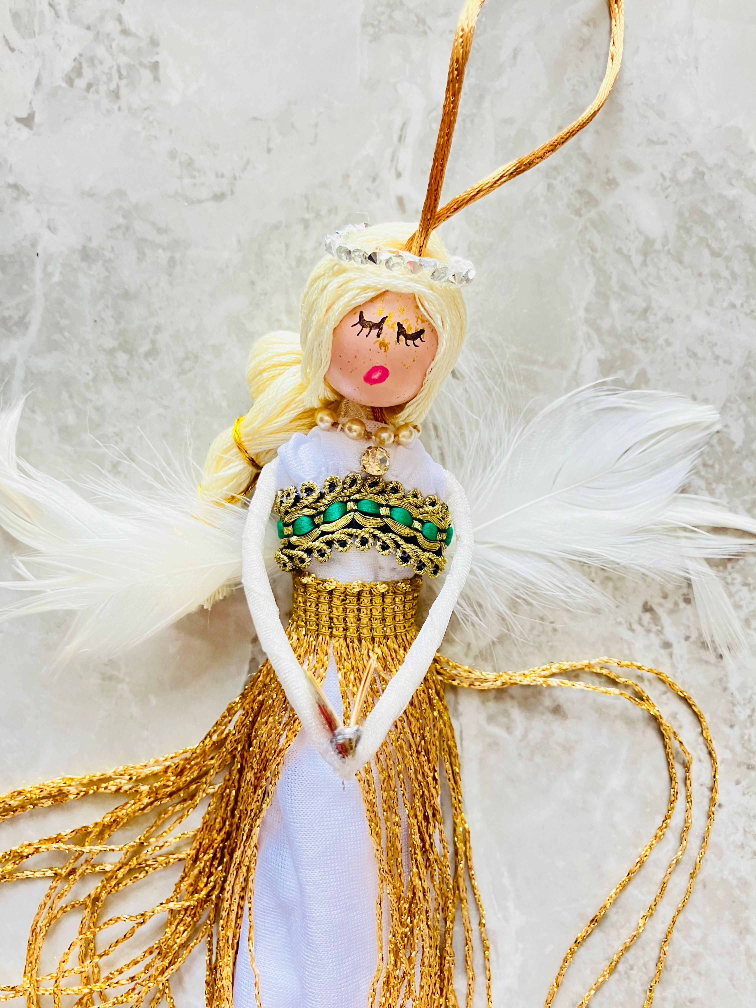 beautiful angel doll with golden skirt
