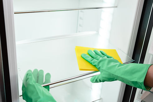man-s-hand-green-glove-cleaning-empty-refrigerator.jpg