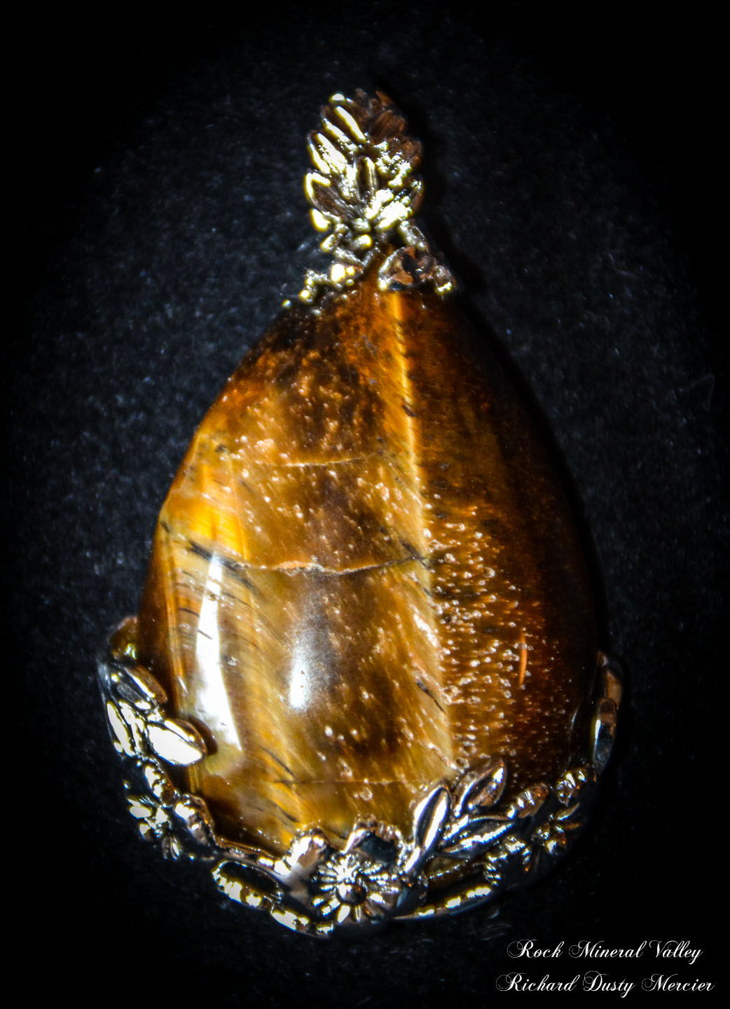 Pendentif goutte Oeil de Tigre cerclage fleures