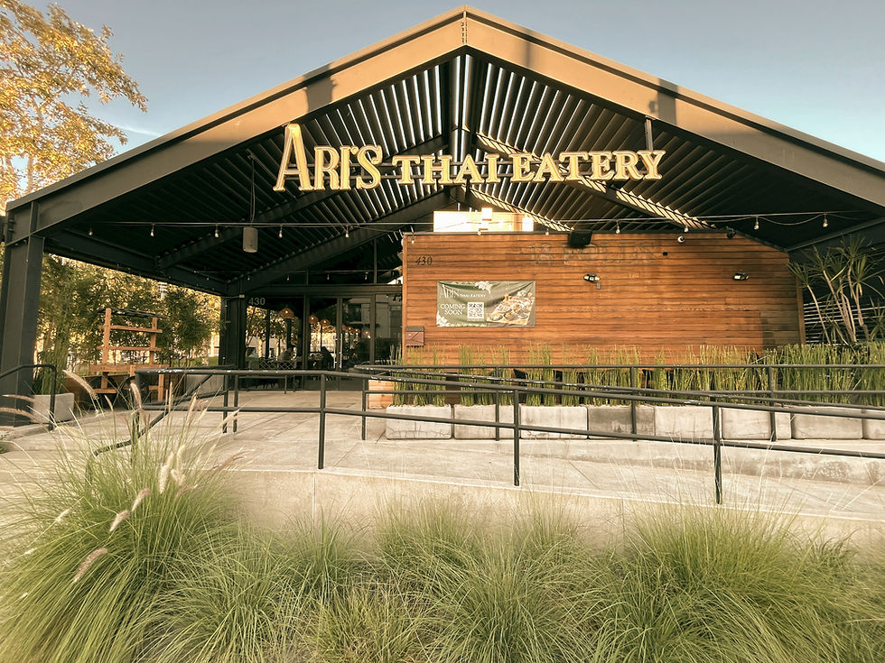 front of Ari's Thai Eatery a farm house style restaurant located at Farmers Park in the Anaheim Packing District