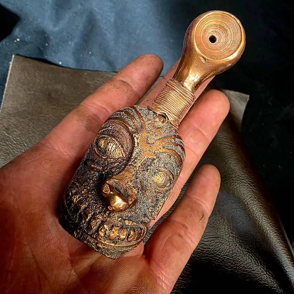 Handheld copper pipe showing scale and detailed craftsmanship