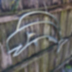 Thumbnail: Side view of metal Mahi fish sculpture showing curved aluminum tubing and weld details