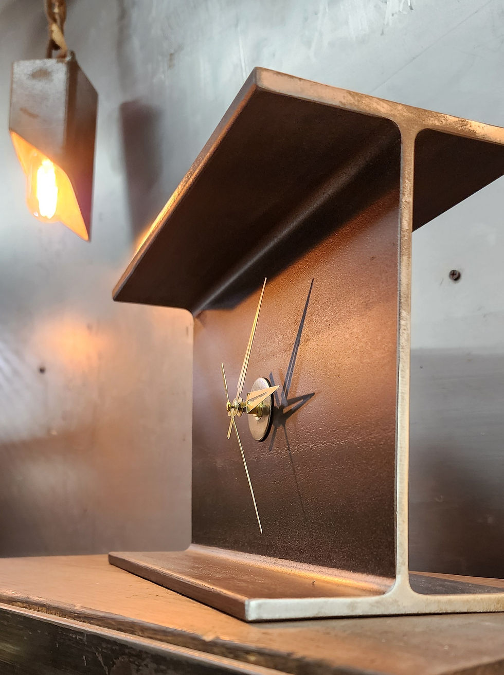 Thumbnail: side angle of steel beam clock showing structural profile