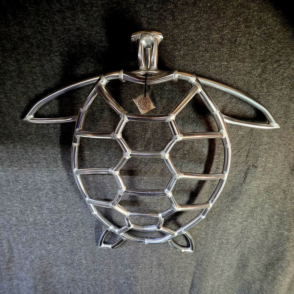 Thumbnail: Handmade nautical sea turtCoastal aluminum turtle sculpture with polished metal finish and handcrafted marine-inspired design