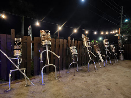 metal kegs fabricated into tiki statues