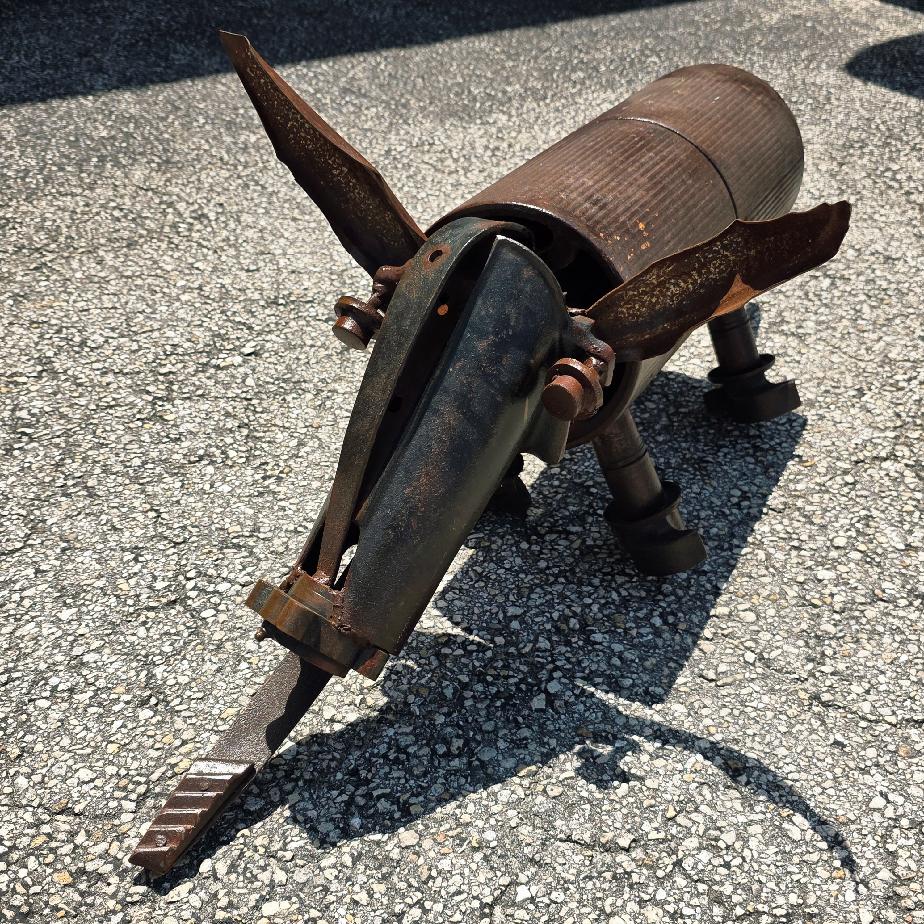 Welded reclaimed metal farm animal sculpture with rustic patina