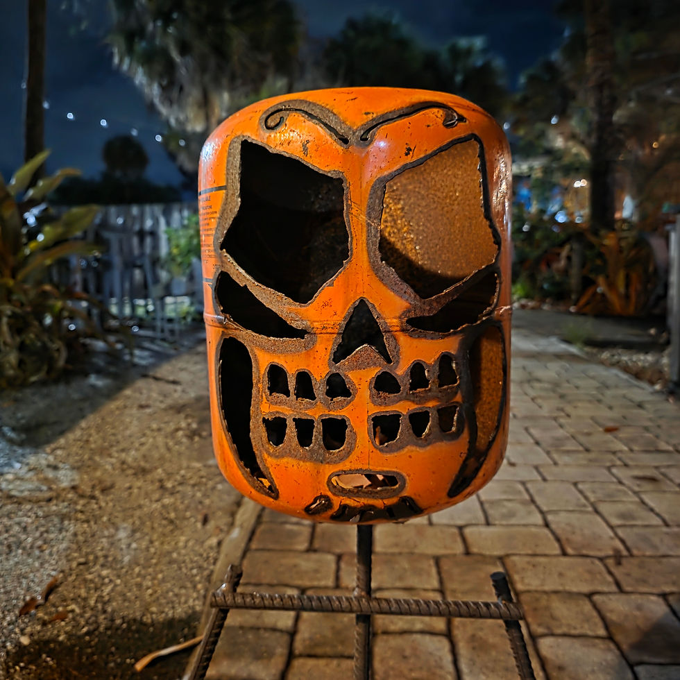Thumbnail: Handmade welded sugar skull metal sculpture standing on a rebar skeletal body with oversized steel feet, featuring a plasma-c