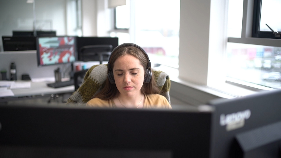 HR Manager Katrín Ingibergsdóttir meditating at her desk.