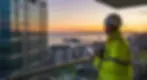 Building surveyor inspecting a new high rise building in Bournemouth, Dorset, UK Banner.we