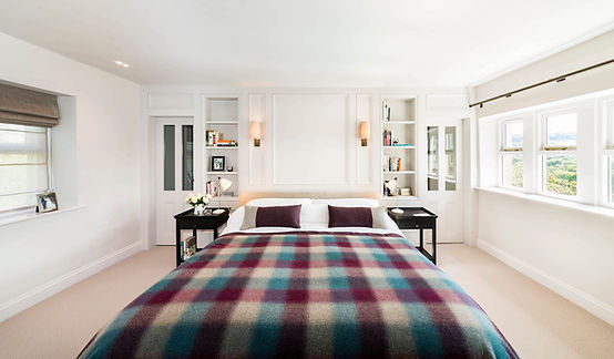 The bed and niches in the main bedroom