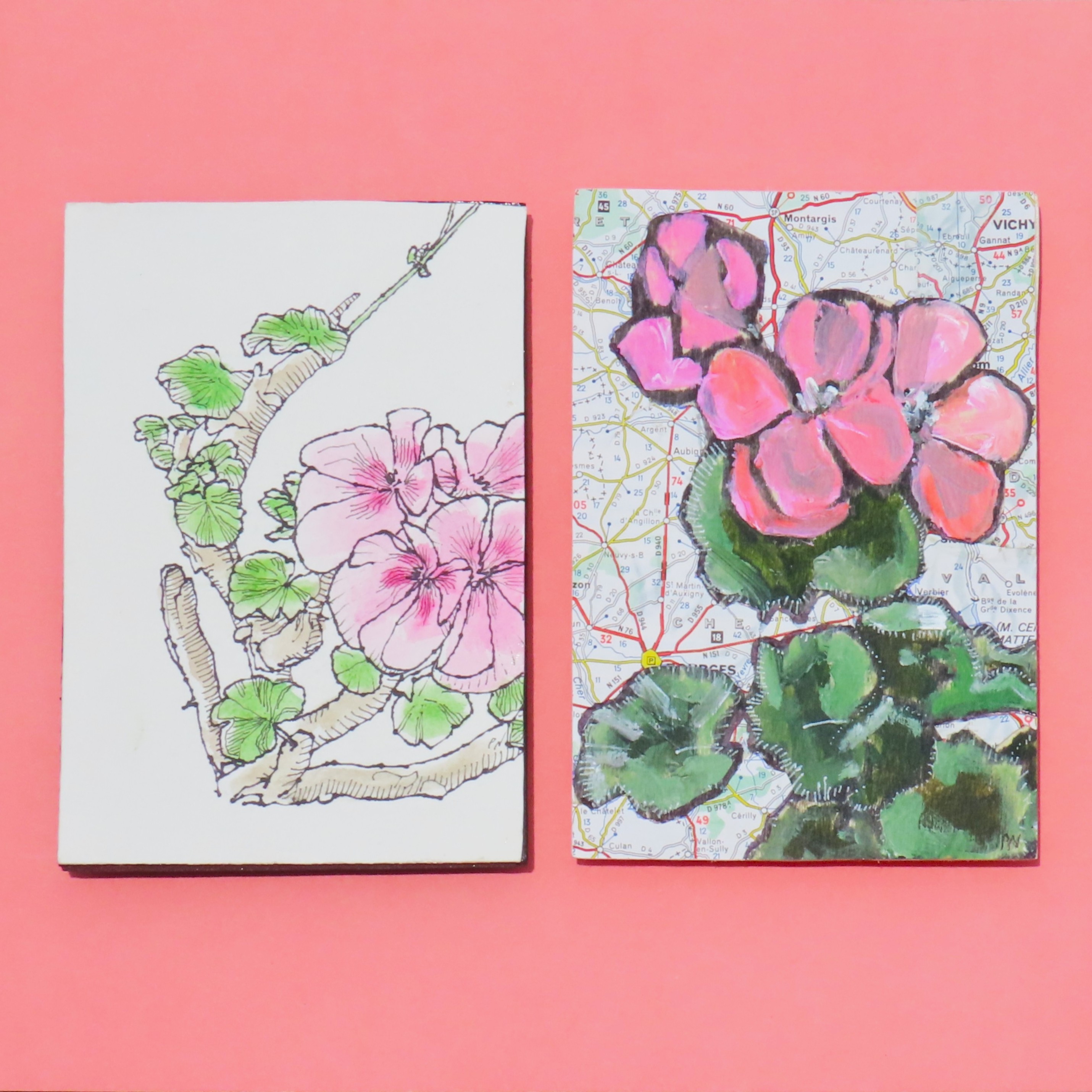 Two pink flowers, one on white paper, one on a printed street map