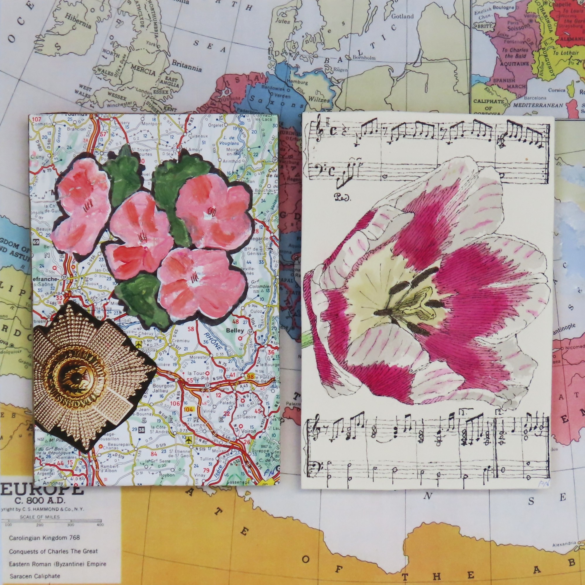 Flowers painted on a map and a sheet of music.