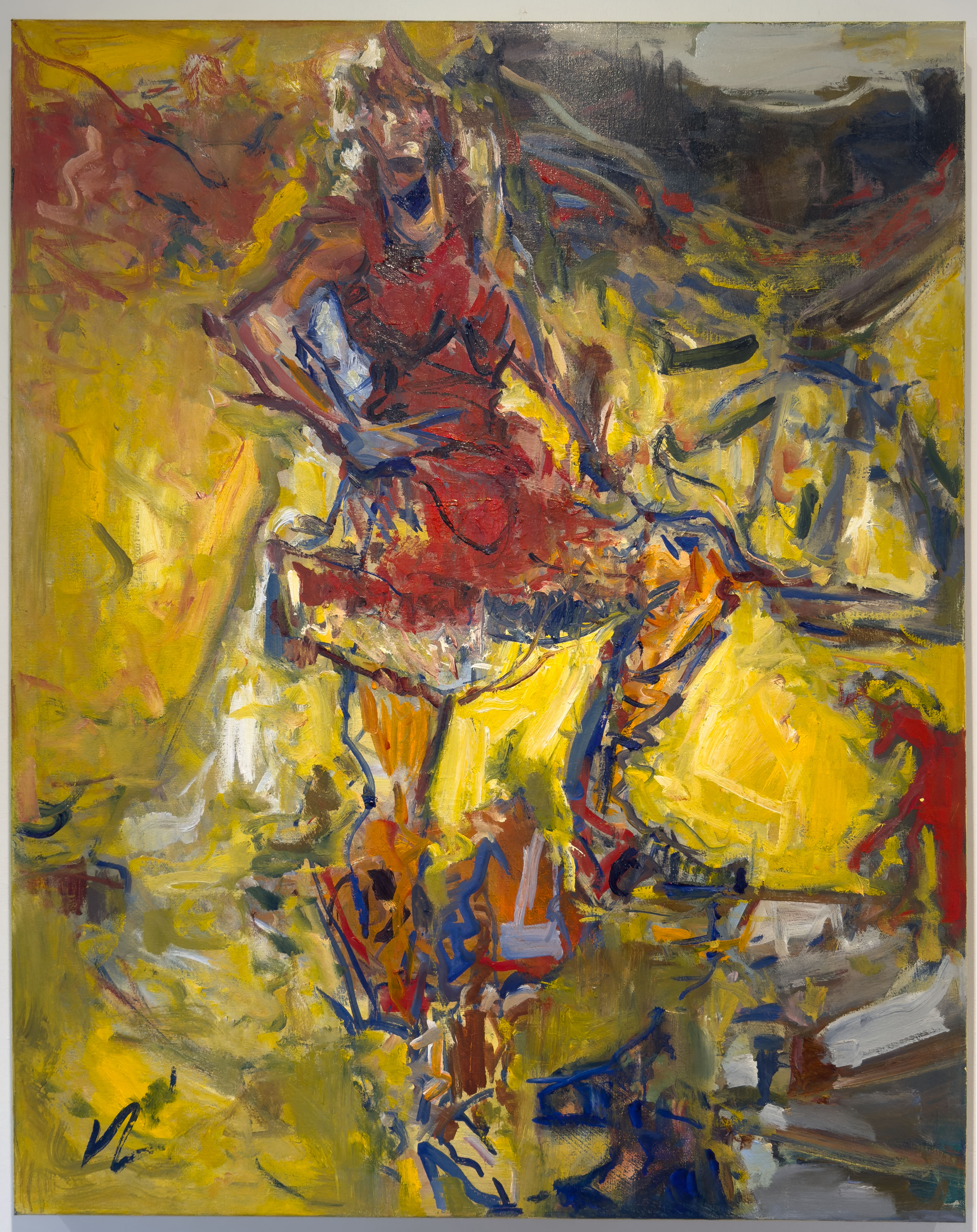 A powerful woman standing with one leg up on a rock. She wears a red dress on a bright yellow background.