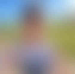 A guy smiling in a selfie of him on a run.