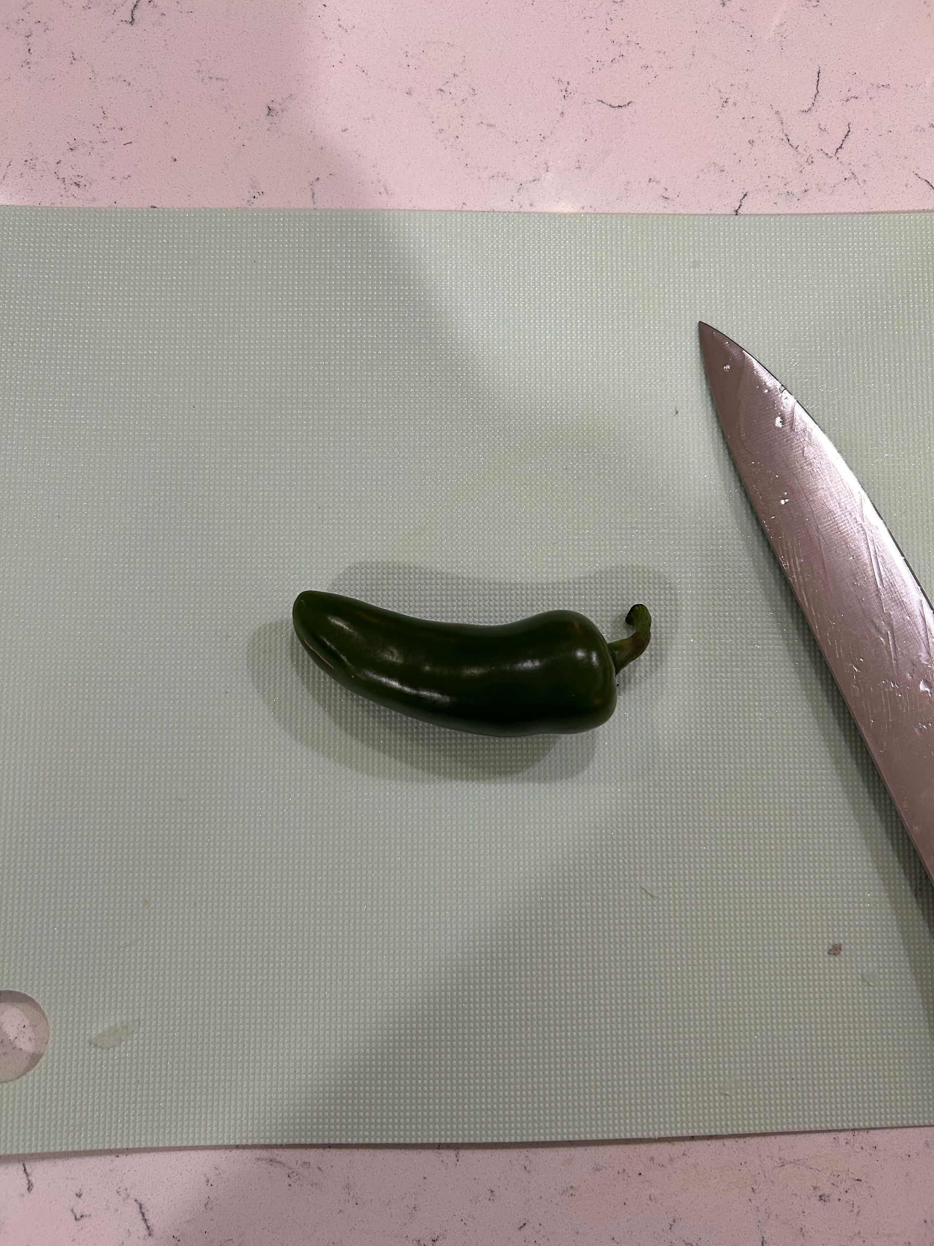 Start with the jalapeno on the cutting board