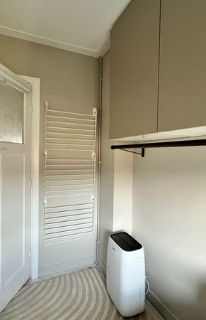Built-in wardrobe with ladder drying rack and dehumidifier - dual-function guest bedroom Haarlem MT Spaces
