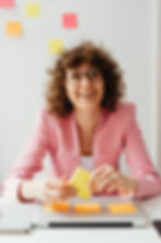 a smiling woman working in an office
