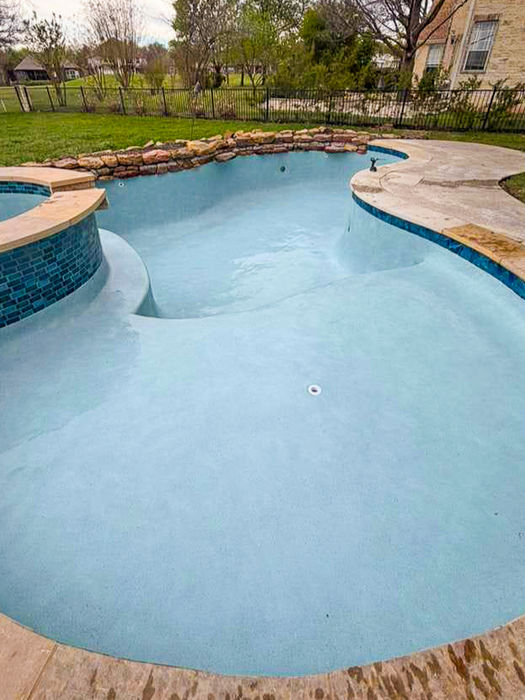 Residential swimming pool resurfaced with StoneScapes Summit Blue plaster