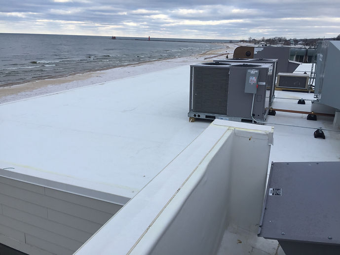White commercial roof by the ocean