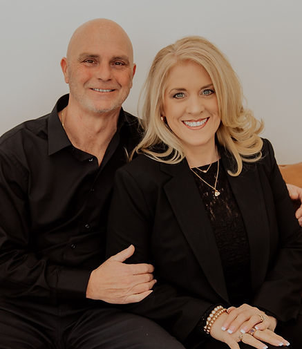 Chris and Laura smiling at the camera