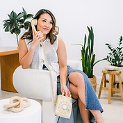 Cindy smiling on the phone
