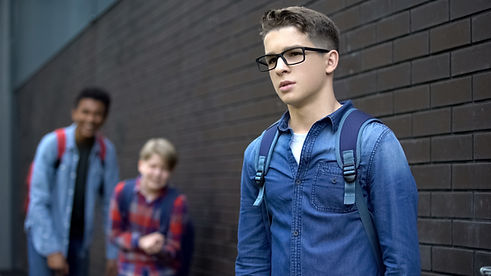 Evil teens mocking boy in eyeglasses, spreading malicious rumors verbal bullying.jpg