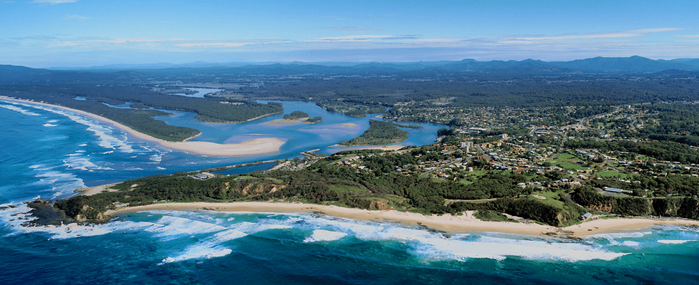 Aerial view of Nambucca Valley, NSW, showcasing the coastline, winding river, lush greenery, and residential areas on the Mid North Coast.