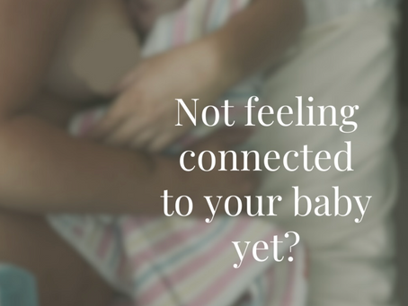 Mother holding newborn baby - text asking not feeling connected to baby yet, about different bonding timelines in pregnancy and postpartum