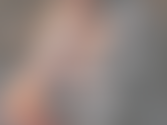 Pregnant woman gently holding her belly while practising nutrient-dense pregnancy nutrition