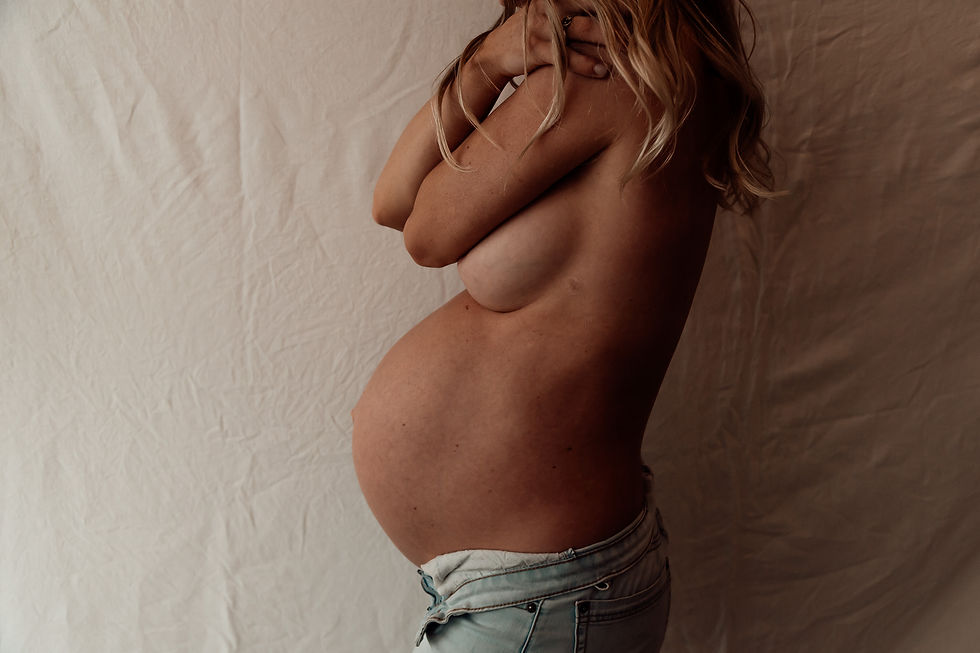 Pregnant woman in soft natural light - symbolising holistic, herbal pregnancy care and personalised support from a clinical herbalist.