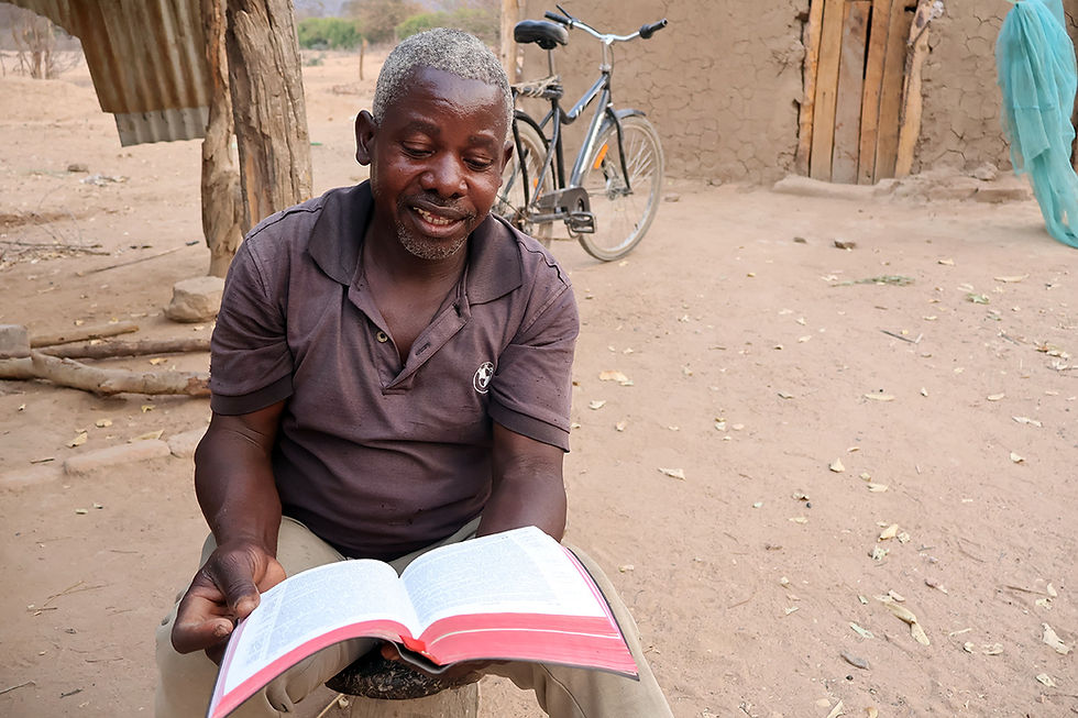 TWFTW More Than Words. Man reading Bible in Native Language