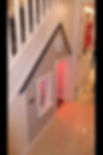 Built-in miniature playhouse under a staircase