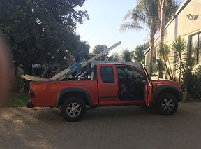 a red van packed with tools to repair a electric fence