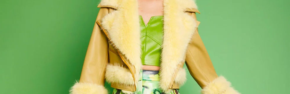 Eye-level view of a stylish faux fur coat hanging on a rack