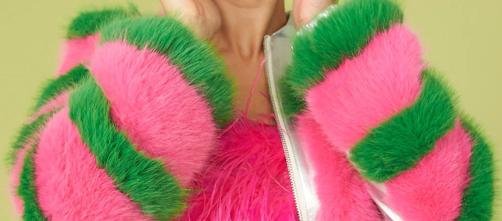 High angle view of a textured faux fur coat draped over a chair