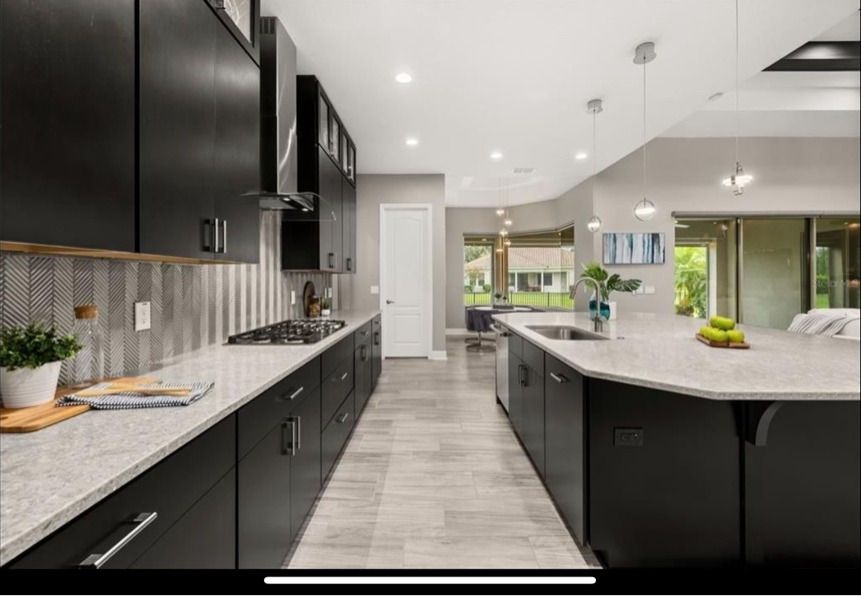 Cooktop run in a matte black kitchen — Kitchen Blueprint project in Winter Garden, FL