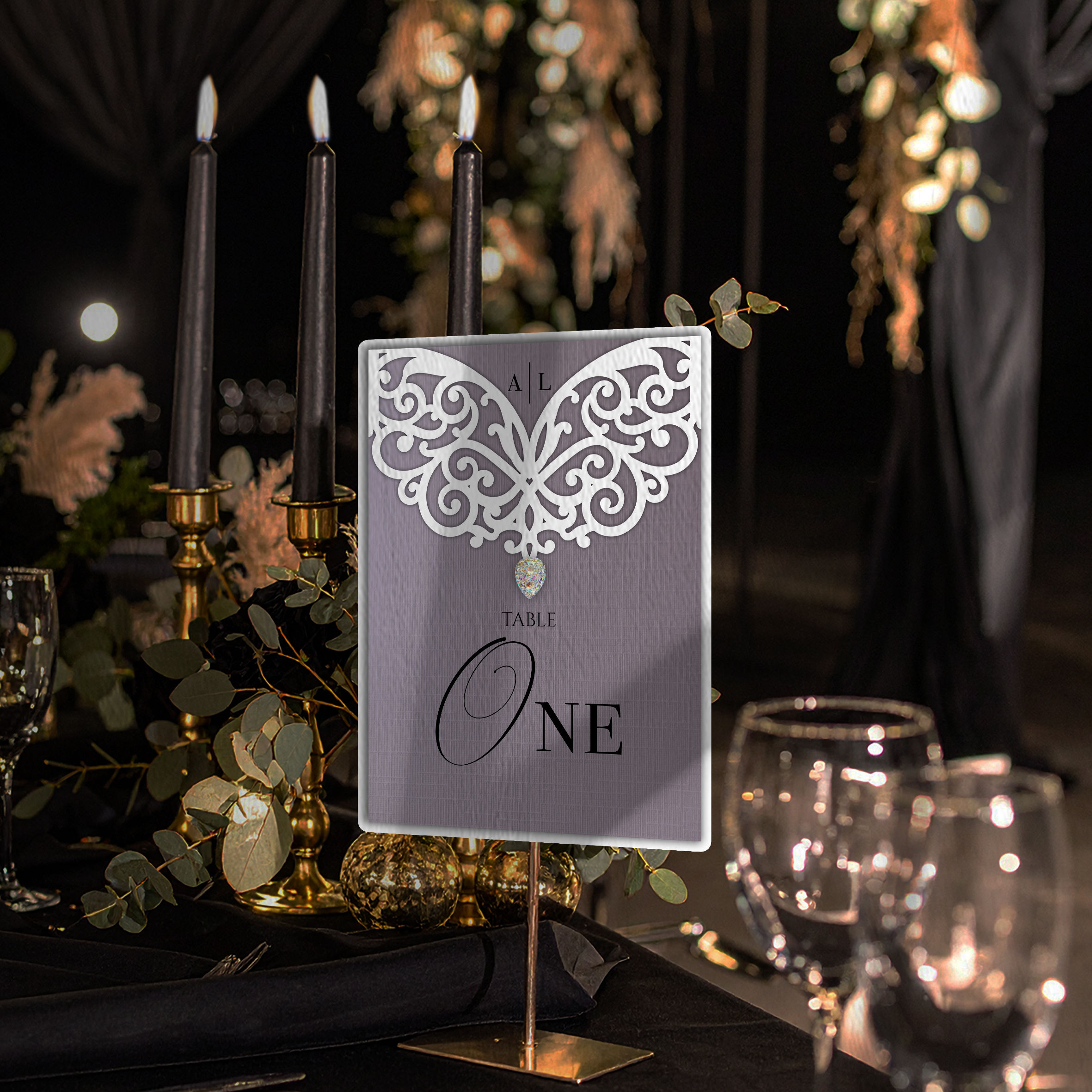 Lace-style wedding table number with intricate cut-out detailing and elegant typography