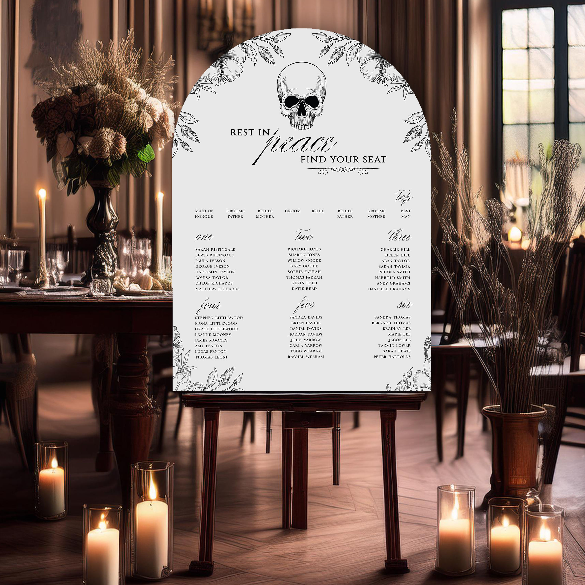 Gothic wedding seating plan sign with skull illustration and floral details