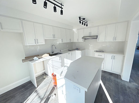 Contemporary kitchen makeover with marble countertops, pendant lighting, and luxury details