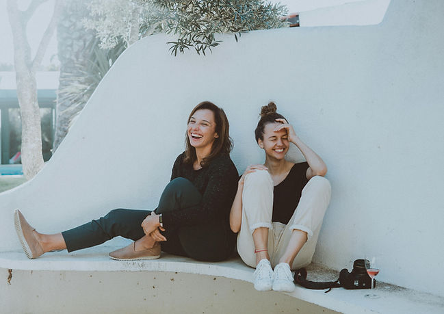 two female friends laughing