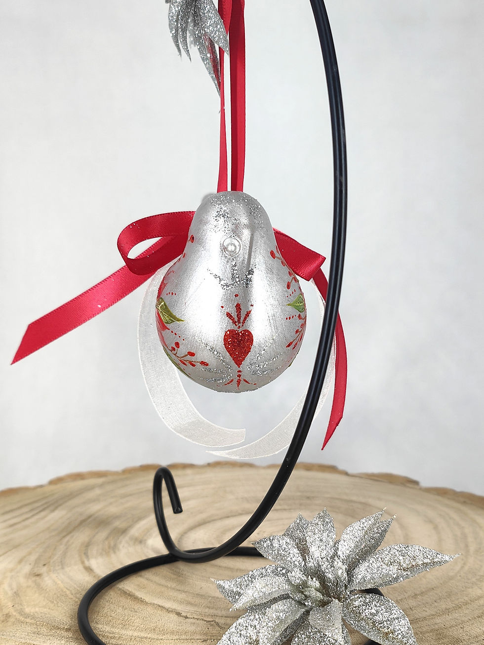 Thumbnail: Folk art heart on the chest of the bauble and on its back, red glitter details