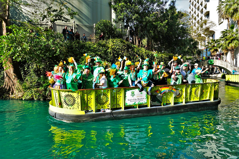 People dressed in green celebrating St. Patrick's Day Parade on the riverwalk in San Antonio Texas