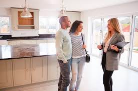 A couple talking to a Realtor