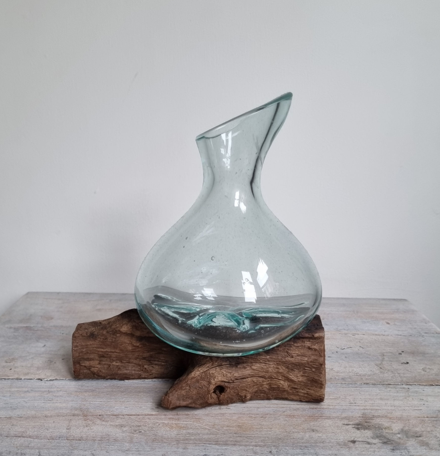 melted glass on wood mini decanter shown from different angles.